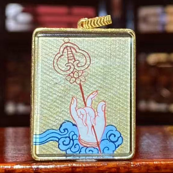 Back view of a Kṣitigarbha Thangka pendant, double-sided and fully hand-painted in 18K gold with refined Rebgong art detailing