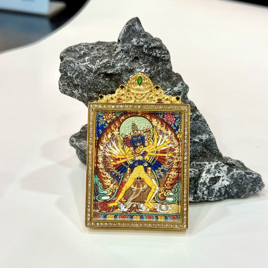 Kalachakra mini thangka pendant displayed upright, highlighting Rebgong painting style, balanced tantric composition, and durable titanium steel casing.