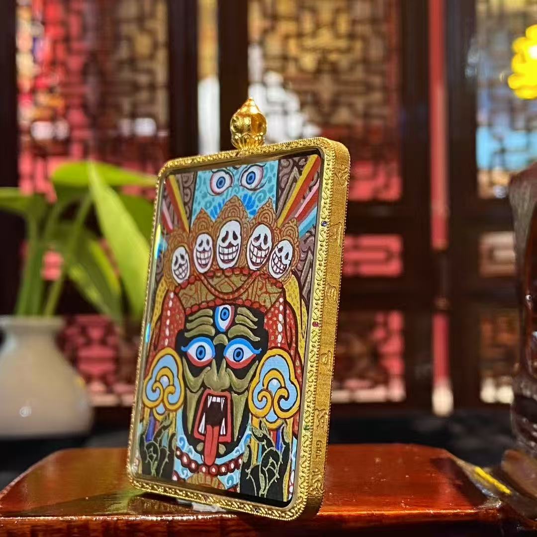 Side view of large Tibetan Gawu box pendant featuring a double-sided 18K gold hand-painted Thangka, sapphire crystal cover, full-detail Rebgong workmanship