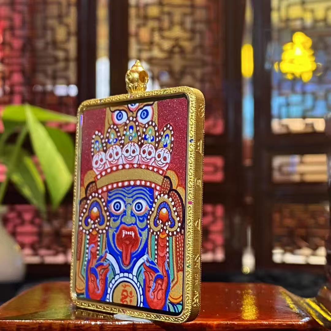 Side view of large Tibetan Gawu box pendant featuring a double-sided 18K gold hand-painted Thangka, sapphire crystal cover, full-detail Rebgong workmanship