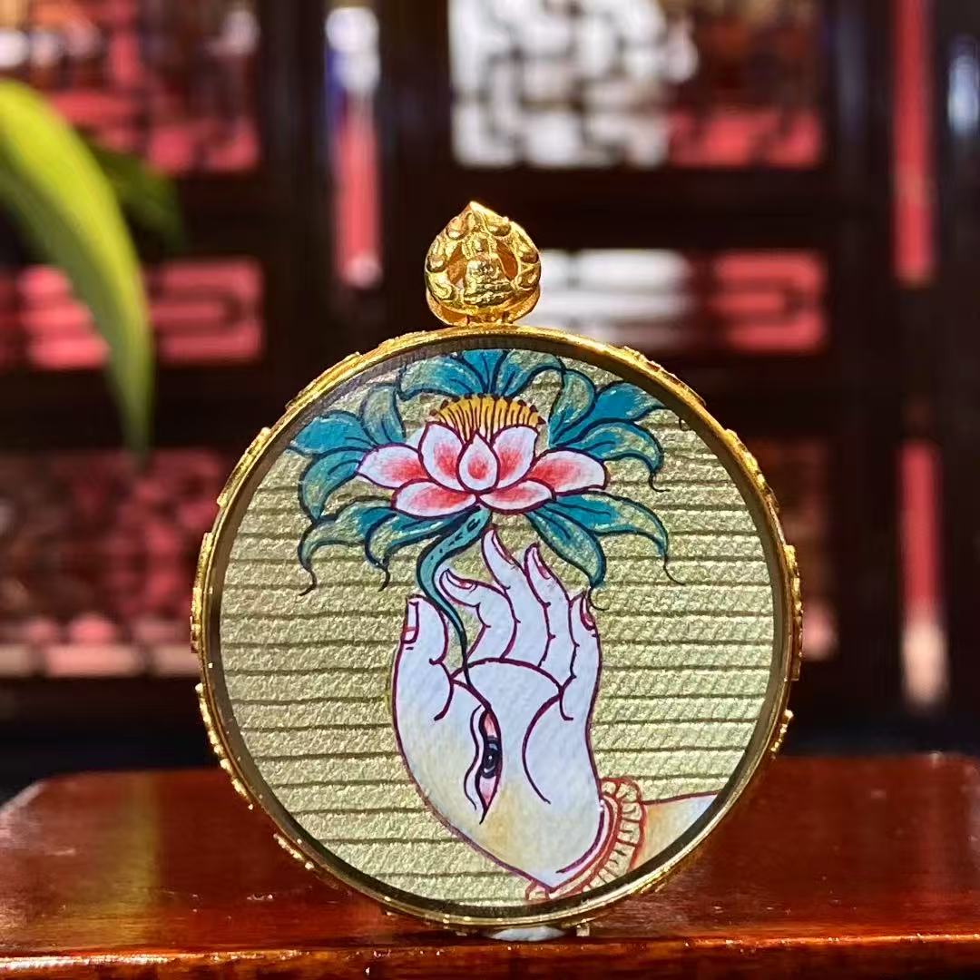 Back view of double-sided Tibetan mini thangka pendant featuring sacred Lotus symbol representing purity and awakening in Buddhism