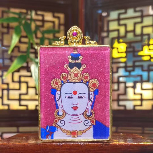 Front view of a hand-painted Mahāsthāmaprāpta (Great Strength Bodhisattva) Gawu pendant in a gold-plated copper case, symbolizing wisdom light, calm focus, and clear thinking