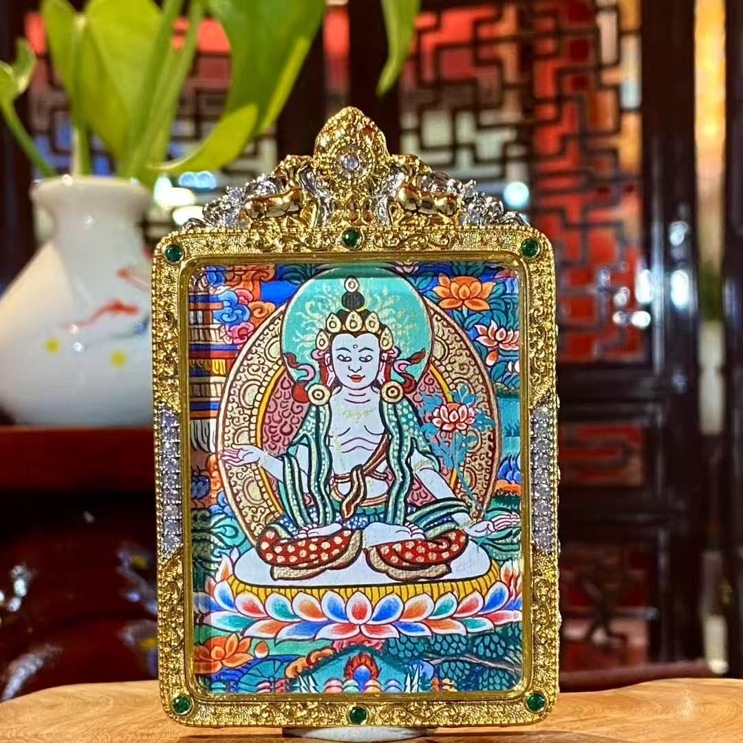 Front view of a hand-painted Mahāsthāmaprāpta (Great Strength Bodhisattva) Gawu pendant in a gold-plated copper case, symbolizing wisdom light, calm focus, and clear thinking