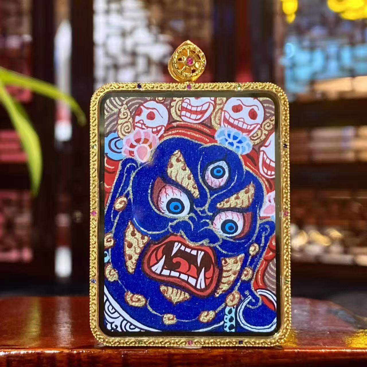 Back view of Mahakala thangka pendant, double-sided 18K gold hand-painted Rebgong Tibetan thangka with wrathful protector iconography