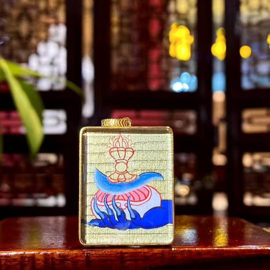 Back view of Mahakala Gau pendant featuring Kapala and Vajra chopper symbolism hand-painted in 18K gold
