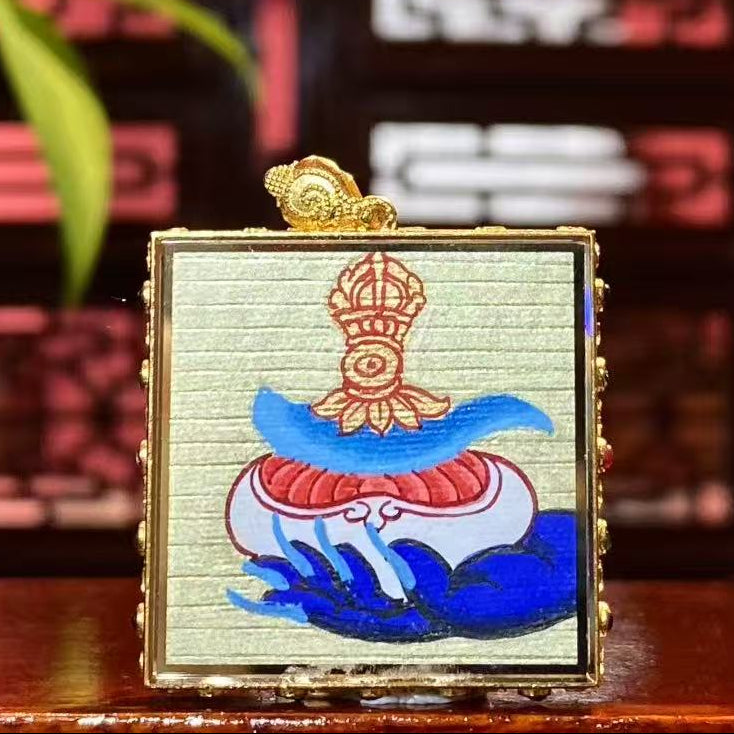 Back view of Mahakala Gau pendant featuring hand-painted Kapala and Vajra chopper symbolism in 18K gold
