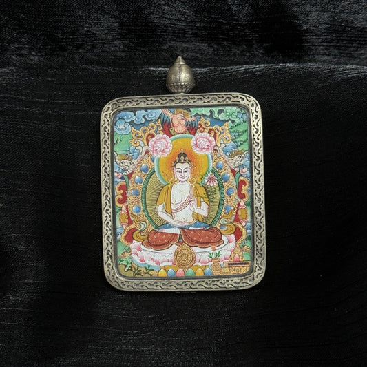 Front view of Mahasthamaprapta Bodhisattva mini thangka pendant, hand-painted with mineral pigments, seated on lotus throne, enclosed in Dunhuang Nine-Colored Deer silver gawu case with engraved border.