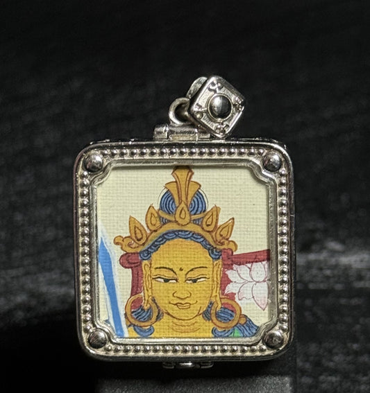 Front view of a hand-painted Manjushri Bodhisattva miniature thangka pendant created with mineral pigments and set in a decorative 925 silver plated frame.