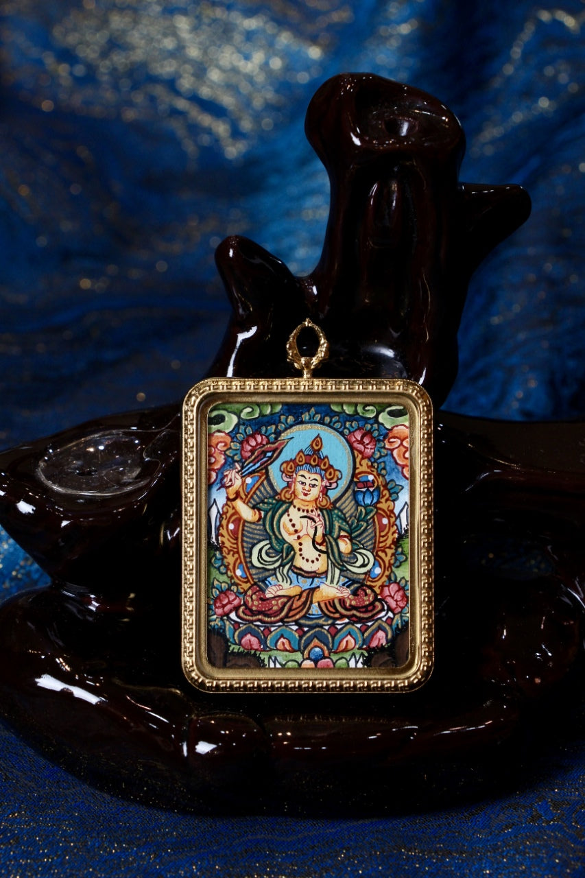 Close-up of Manjushri Bodhisattva hand-painted mini thangka pendant in gold-tone titanium-steel case