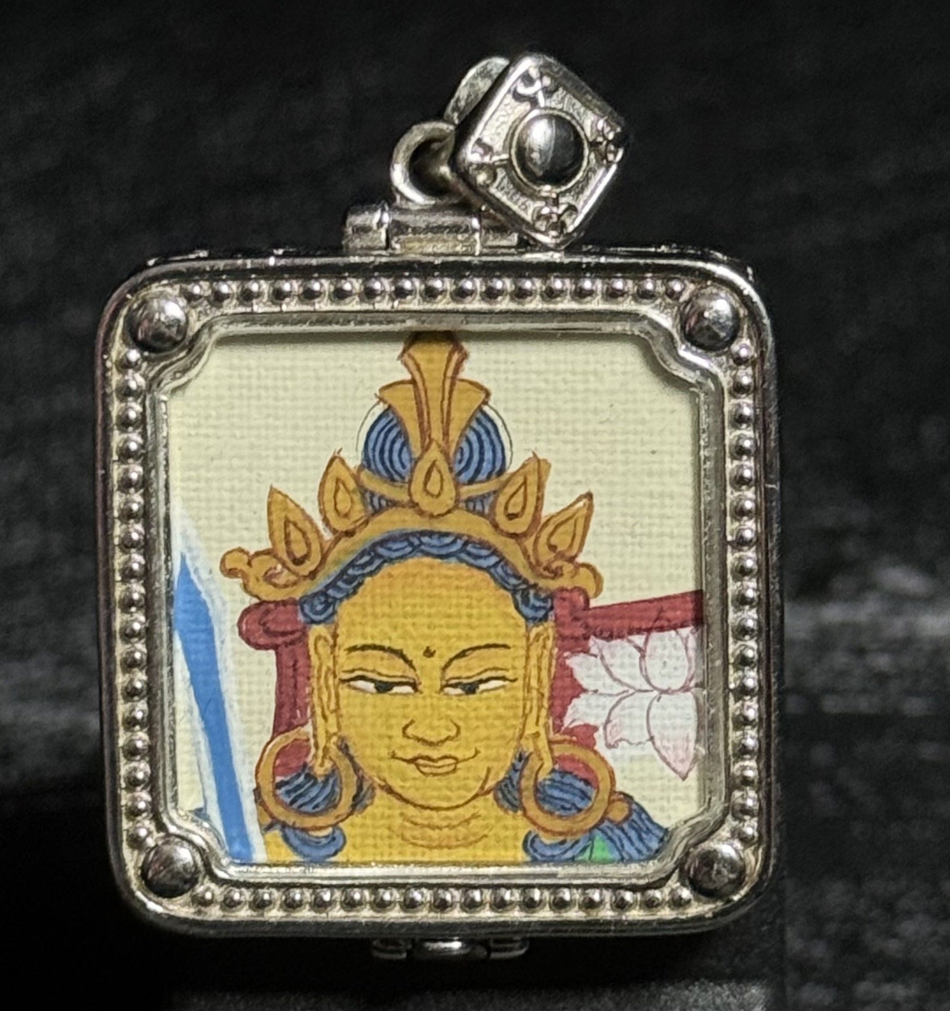 Hand-painted Manjushri Wisdom Buddha pendant, featuring a red & gold Buddha head with 925 silver plating, created in the traditional Tibetan Thangka style. A protector for Rabbit and Gemini zodiac signs.