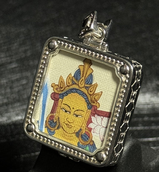 Close-up view of the hand-painted Manjushri Wisdom Buddha pendant with 925 silver plating, representing the Buddha of Wisdom. Ideal spiritual guardian for those born under the Rabbit and Gemini zodiac signs.