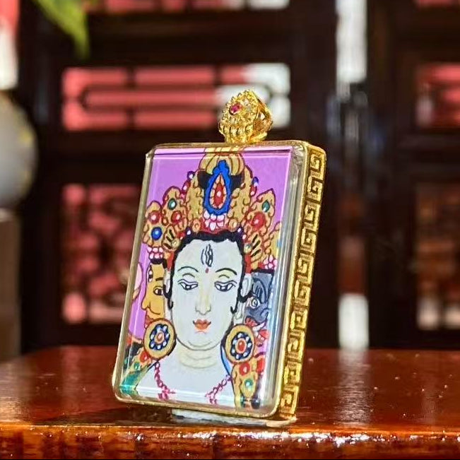 Side view of Marici Devi Thangka pendant showing 18K gold Gawu box and double sapphire crystal scratch-resistant lenses