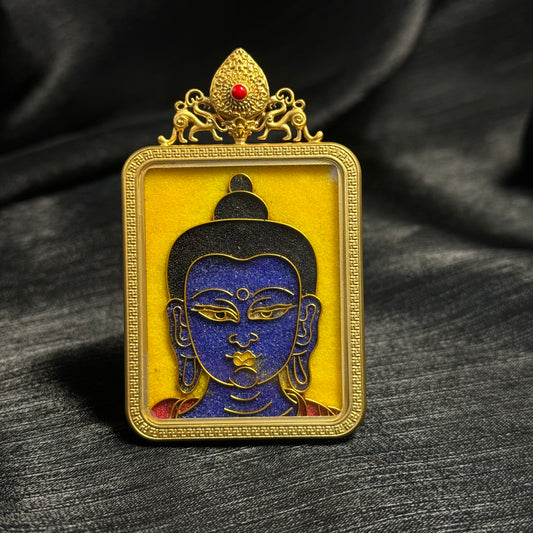 Front view of Medicine Buddha cloisonné enamel mini thangka pendant featuring blue Buddha face design, yellow enamel background, and 24K gold-plated copper frame