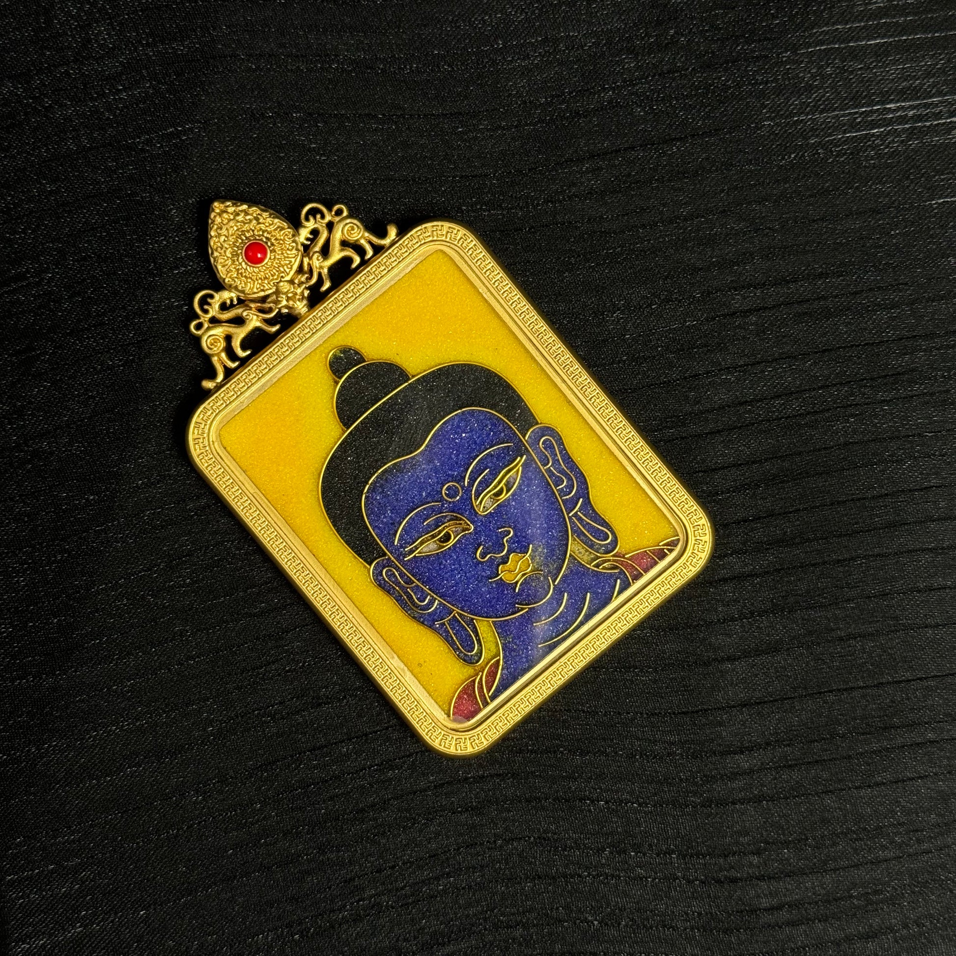 Full display of handcrafted Medicine Buddha cloisonné enamel mini thangka pendant with decorative gold-plated top ornament and vibrant enamel artwork