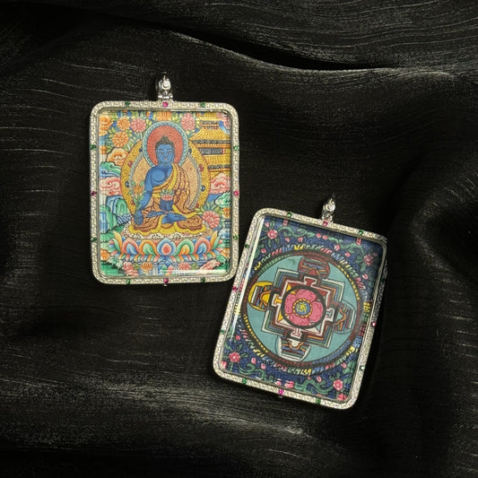 Front and back view of a Medicine Buddha mini thangka pendant showing the hand-painted Medicine Buddha and a detailed Tibetan mandala design on the reverse side, framed in a decorative pendant case.