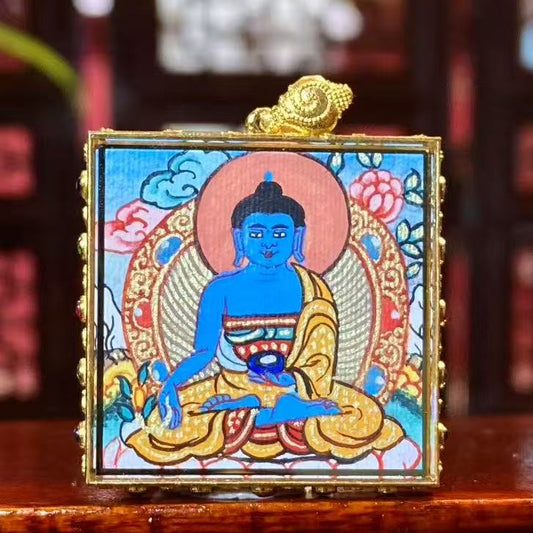 Front view of Medicine Buddha (Bhaisajyaguru) Tibetan mini thangka pendant, double-sided hand-painted in 18K gold, Rebgong tradition
