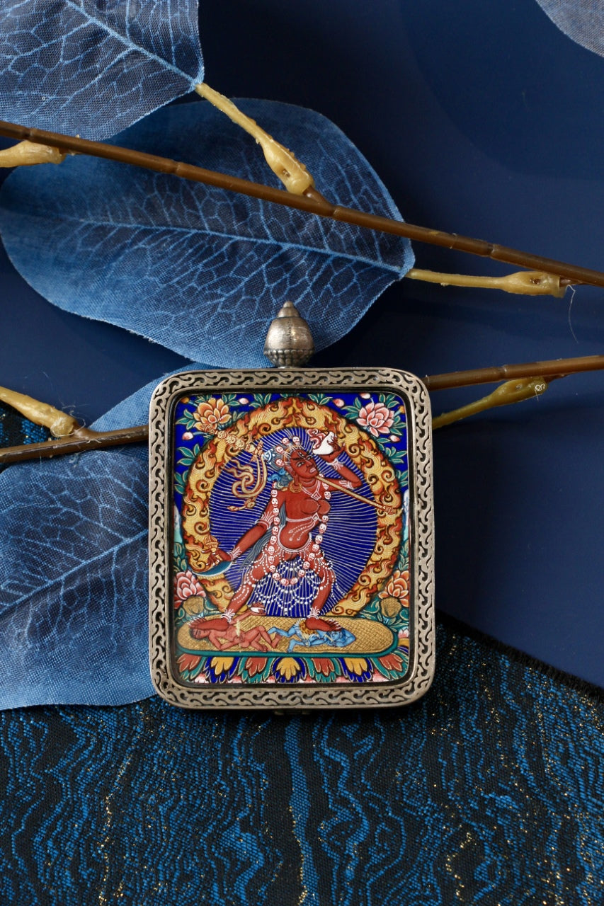 Naro Khechari Dakini mini thangka pendant displayed for travel and personal shrine use, emphasizing portable Rebgong thangka format