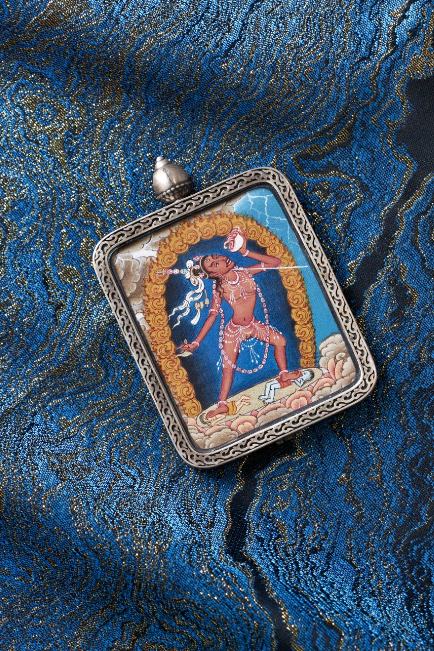 Naro Khechari Dakini mini thangka pendant displayed for devotional and collectible use, emphasizing Tibetan Vajrayana dakini imagery
