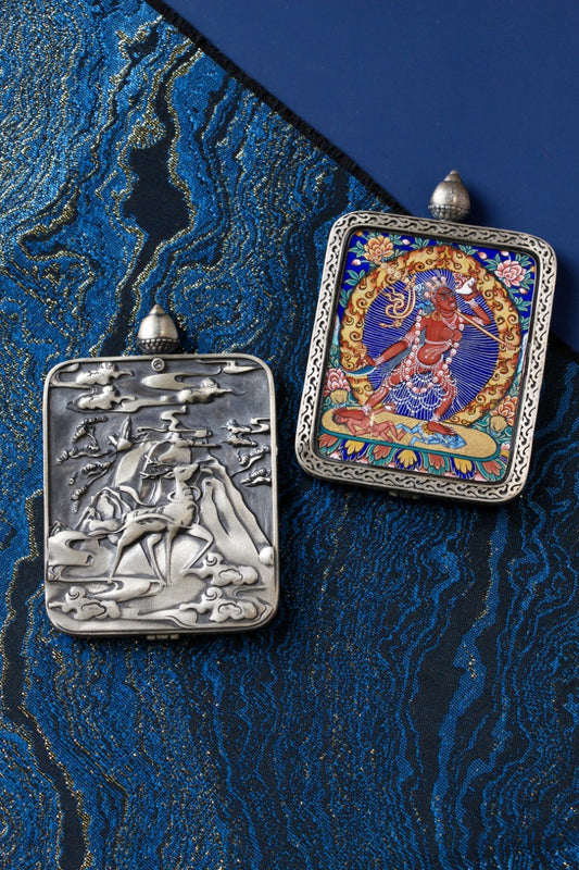Naro Khechari Dakini mini thangka pendant shown with a Dunhuang Nine-Colored Deer silver gawu case, highlighting Rebgong mineral pigment painting and hand-crafted setting