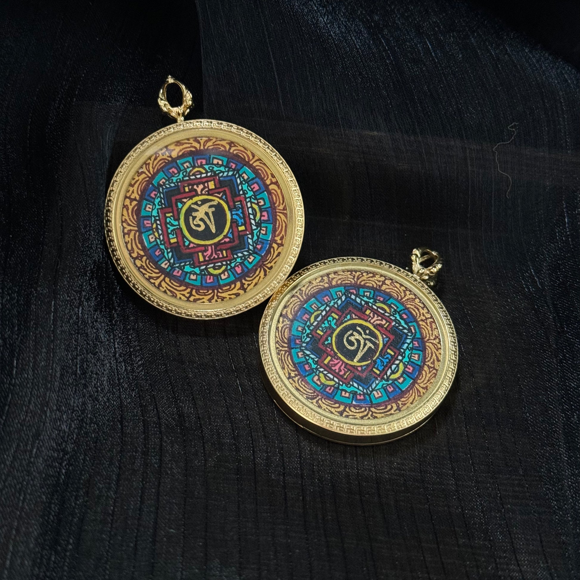 Angled view of Nepal miniature mandala thangka pendant highlighting geometric mandala structure and vibrant traditional mineral pigment colors