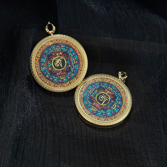 Angled view of Nepal miniature mandala thangka pendant highlighting geometric mandala structure and vibrant traditional mineral pigment colors