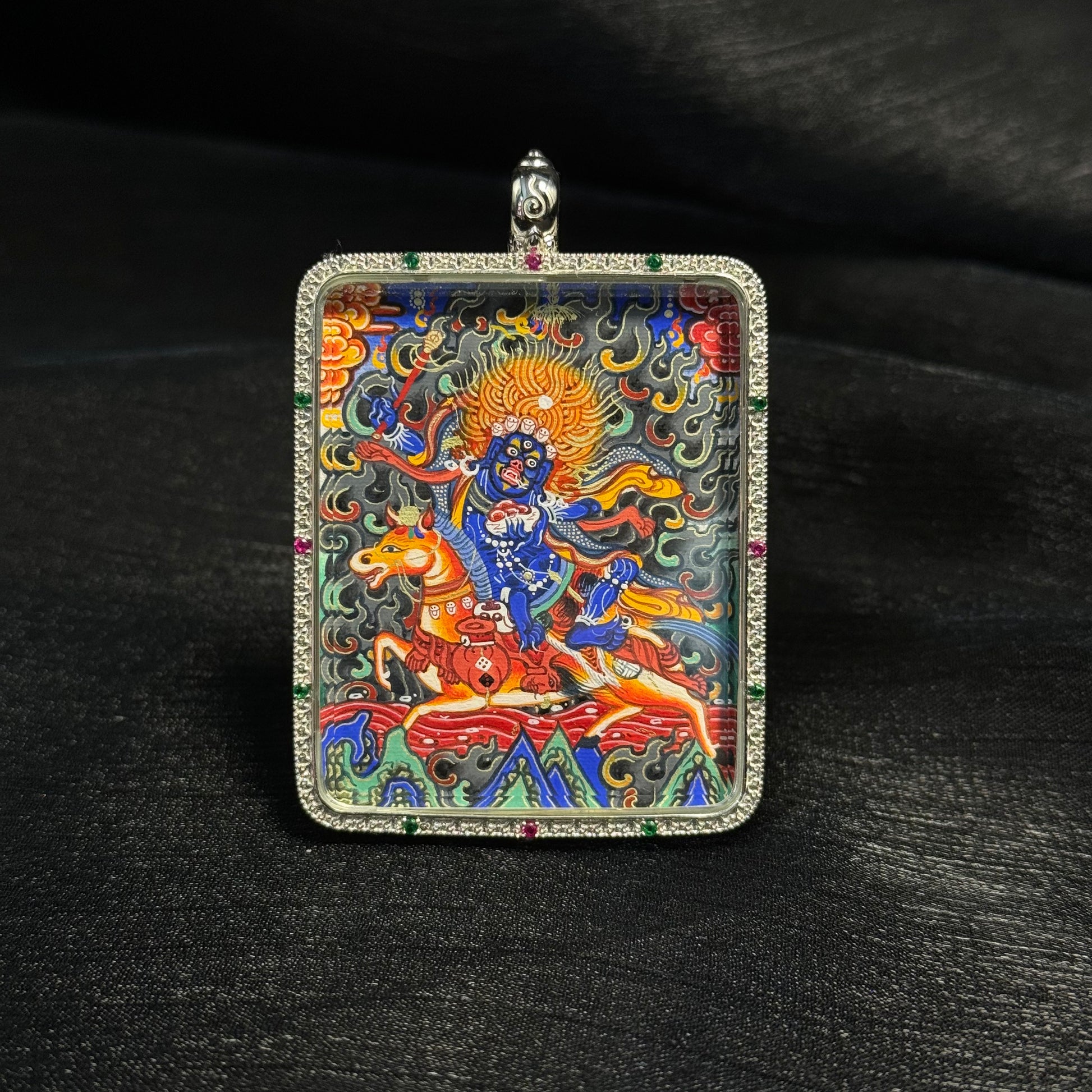 Front view of Palden Lhamo mini thangka pendant featuring hand-painted Rebgong style artwork with mineral pigments, gold powder detailing, and decorative gemstone frame.