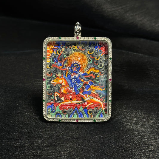 Front view of Palden Lhamo mini thangka pendant featuring hand-painted Rebgong style artwork with mineral pigments, gold powder detailing, and decorative gemstone frame.