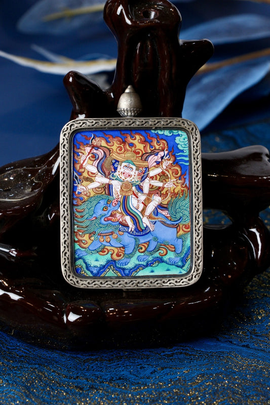 Pehar Gyalpo Tibetan protector deity mini thangka pendant displayed for spiritual protection and career success