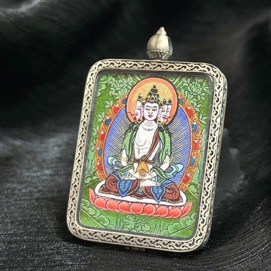 Close-up of Rebgong Cui Thangka painting showing layered mineral green and lapis-blue tones with gold powder cosmic patterns, representing Dharmadhatu wisdom in Vairocana Buddha art