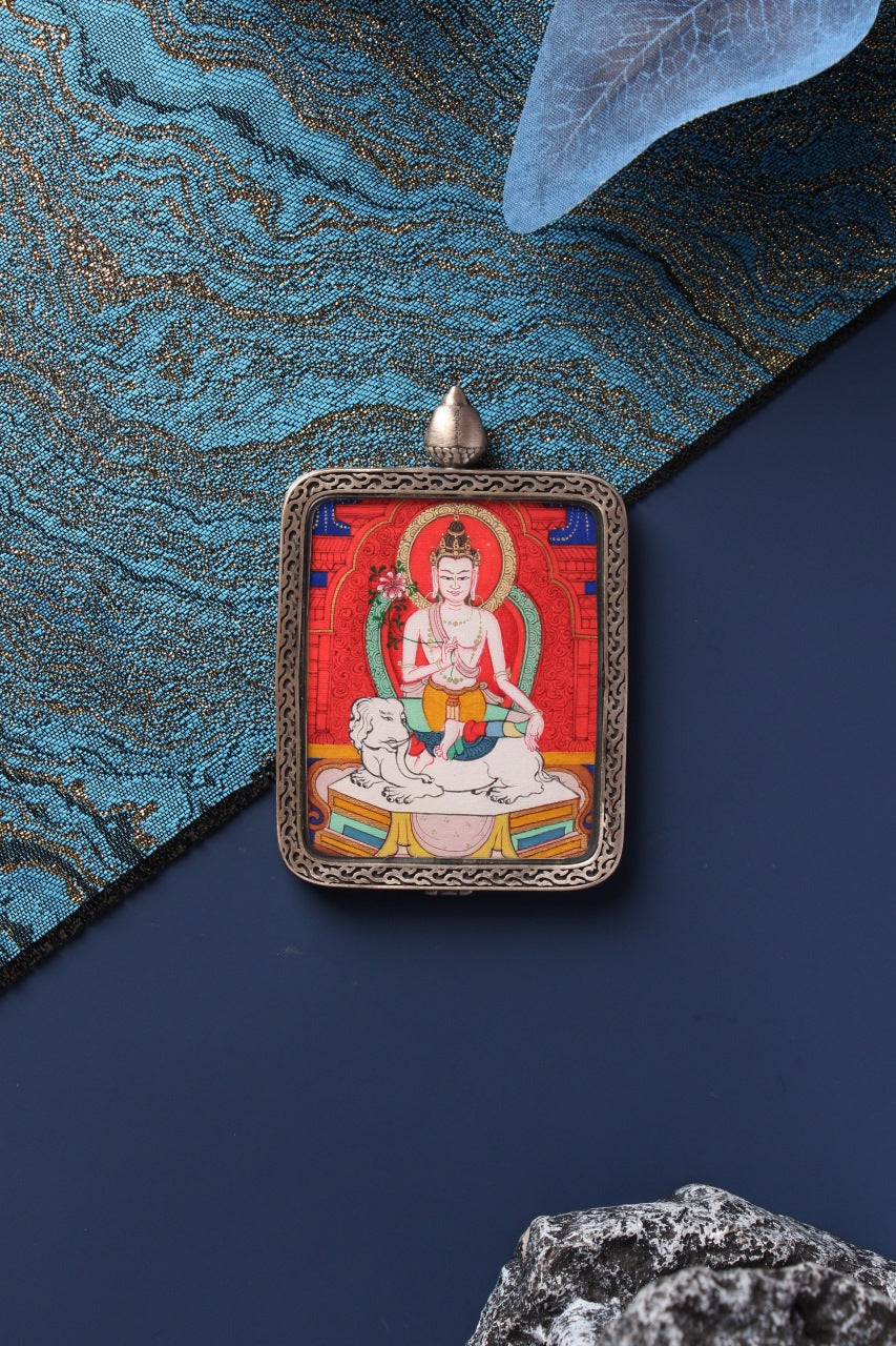Front view close-up of Samantabhadra Bodhisattva mini thangka pendant with detailed silver frame and red thangka painting