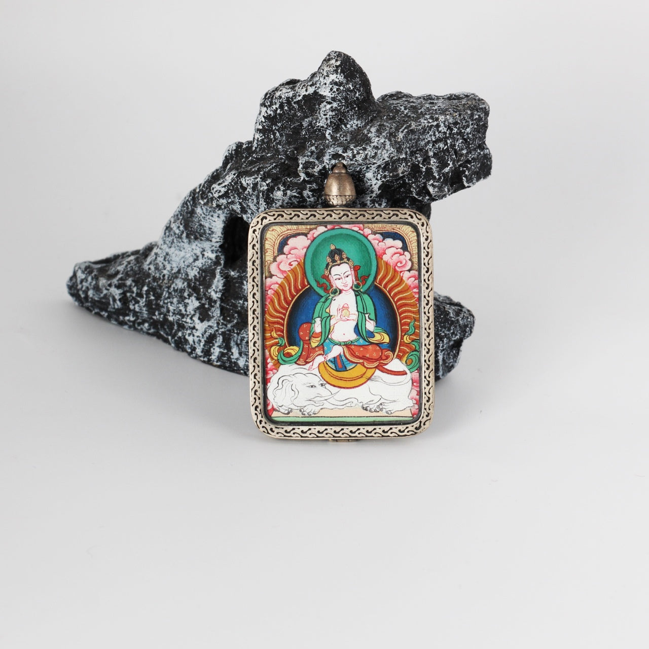 Front view of Samantabhadra Bodhisattva mini Thangka pendant, fully hand-painted with mineral pigments and set in a pure silver gawu-style pendant case with traditional Tibetan decorative patterns.