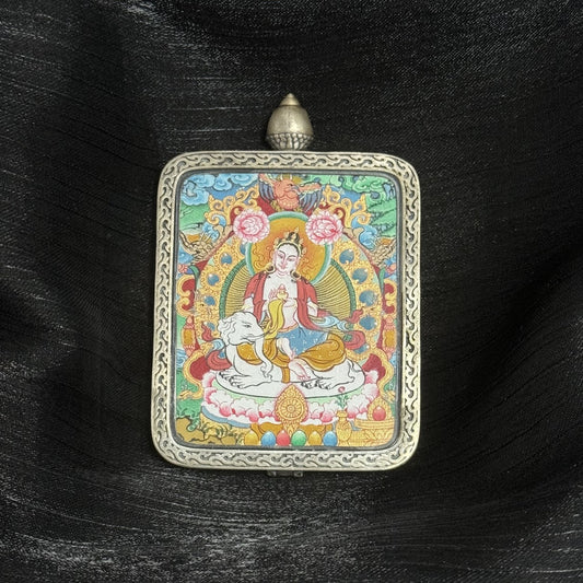 Front view of Samantabhadra Bodhisattva mini thangka pendant, hand-painted with mineral pigments, seated on white elephant, enclosed in Dunhuang Nine-Colored Deer silver gawu case with engraved border.