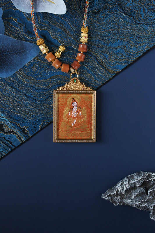 Hand-painted Samantabhadra Bodhisattva mini thangka pendant in Rebgong gold thangka style, featuring mineral pigment artwork, square double-sided titanium steel case, and ornate top bail with gemstone detail