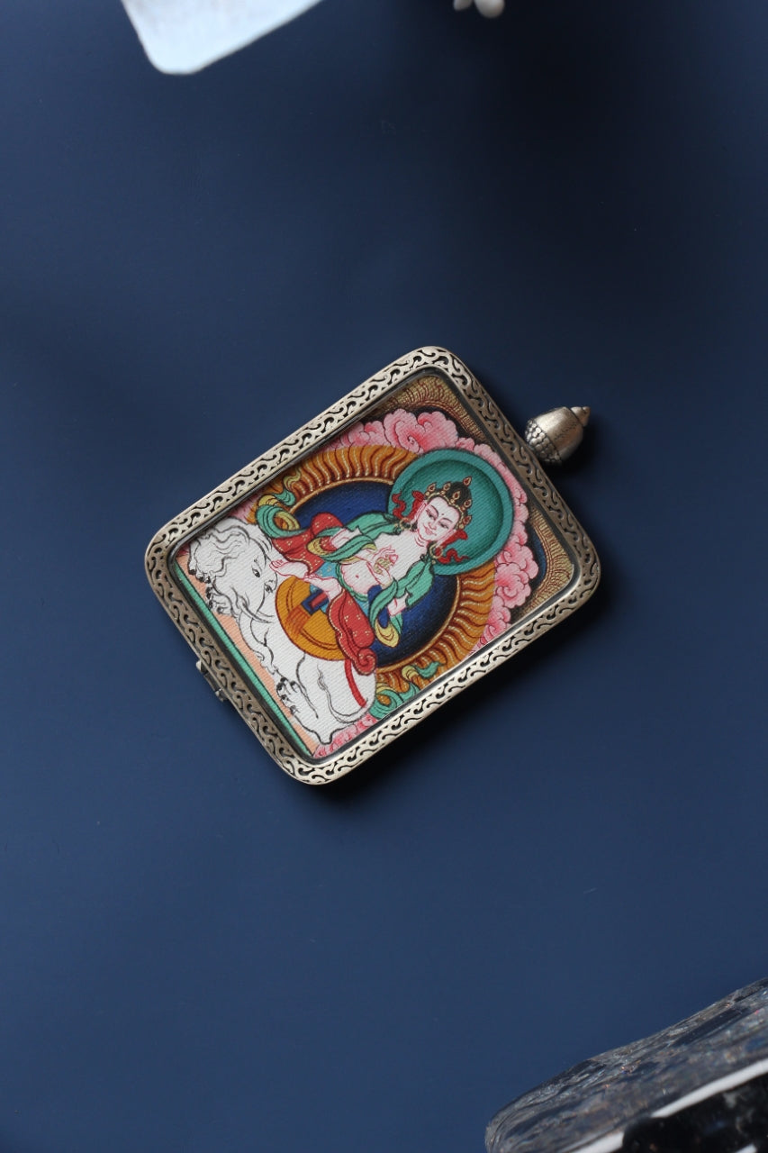 Front view of Samantabhadra Bodhisattva mini thangka pendant, hand-painted with natural mineral pigments and set in a Tibetan silver gawu-style case