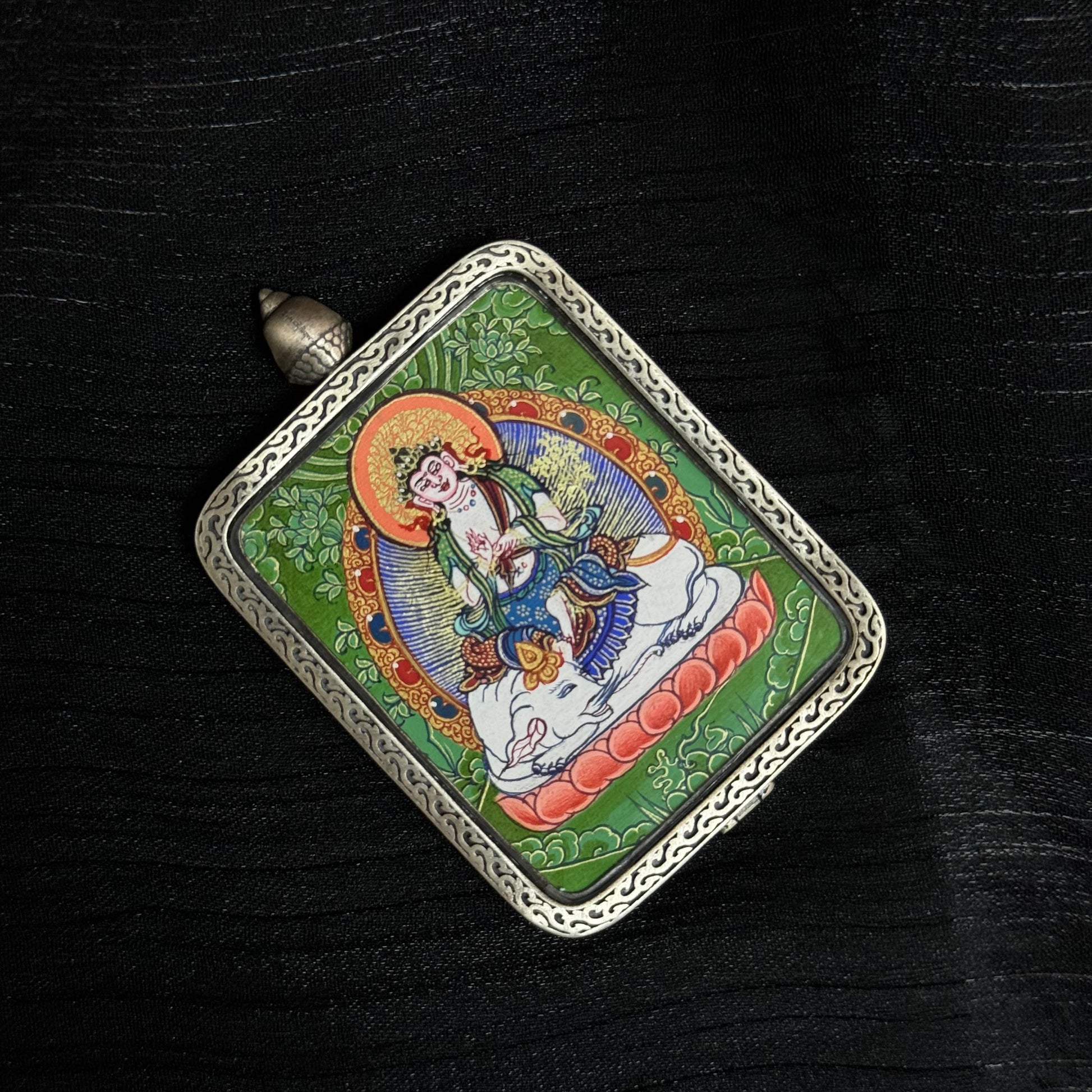 Top angle view of Samantabhadra Bodhisattva mini thangka pendant highlighting hand-painted Tibetan thangka artwork and detailed metal pendant frame