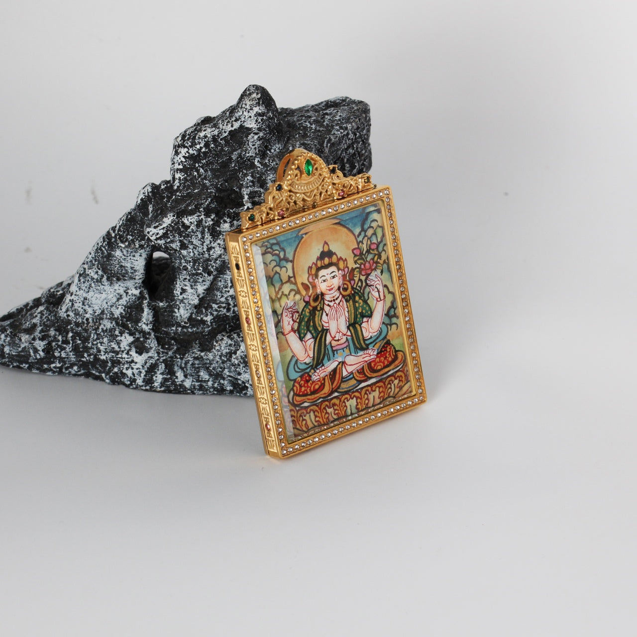 Side profile showing thickness and jeweled frame details of the double-sided titanium steel case for the Four-Armed Avalokiteshvara mini thangka pendant, 4×5.