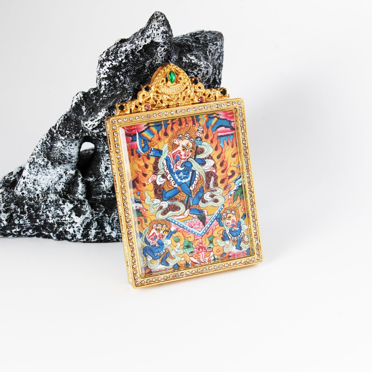 Close view of Simhamukha Dakini mini thangka pendant highlighting precise line work, vivid Nepalese color palette, and double-sided hand-painted craftsmanship