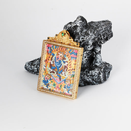 Angled view of Simhamukha Dakini mini thangka pendant showing layered hand-painted details, vibrant mineral pigments, and structured titanium steel pendant housing
