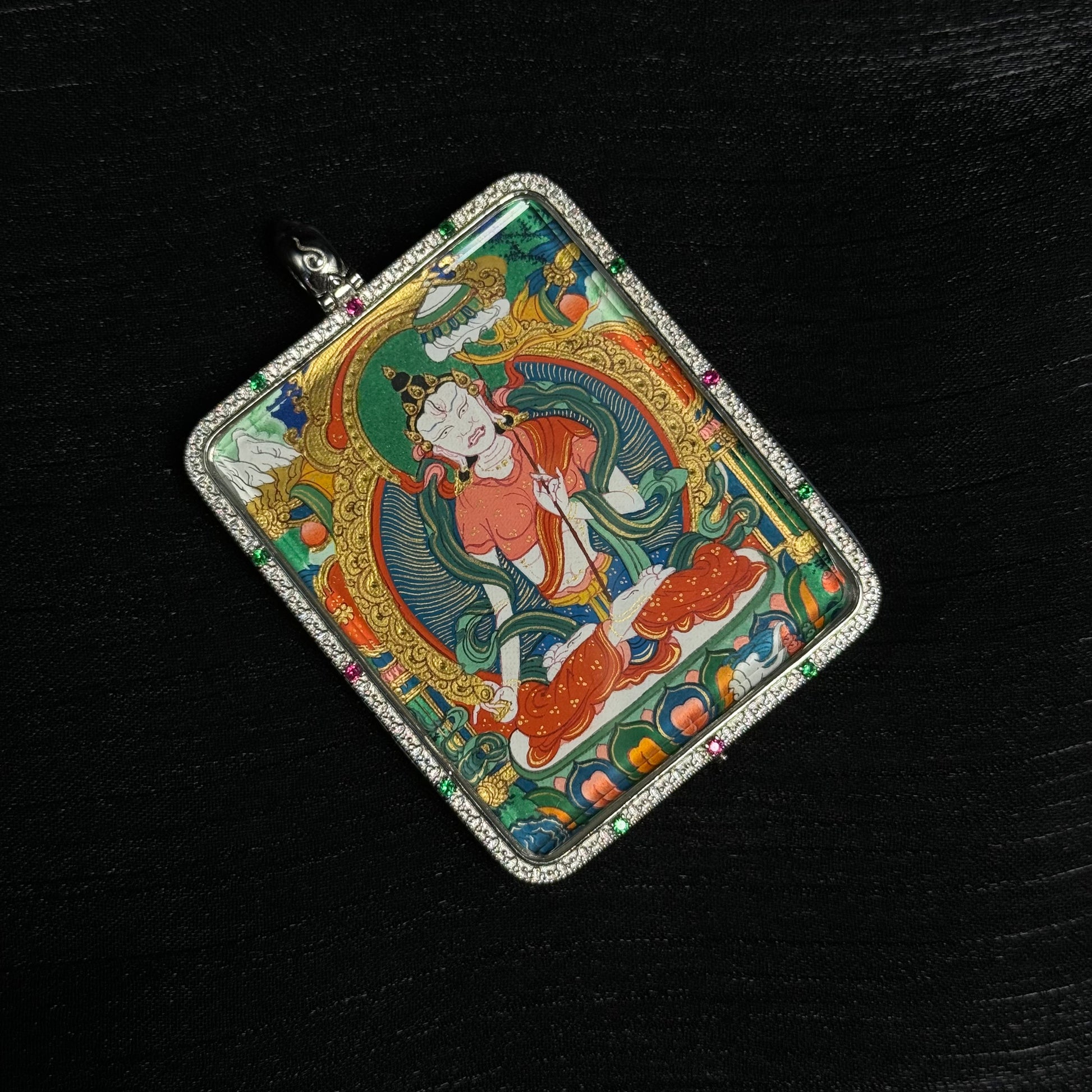 Detailed view of Sitatapatra White Umbrella Deity pendant displaying hand-painted Tibetan thangka composition, vibrant mineral colors, and ornate gemstone frame.