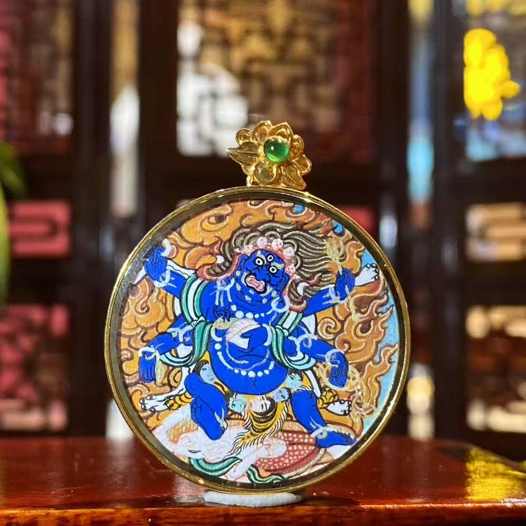 Front view of Six-Armed Mahakala Gau pendant, hand-painted with 18K gold in the Rebgong Tibetan tradition, circular protector deity pendant

