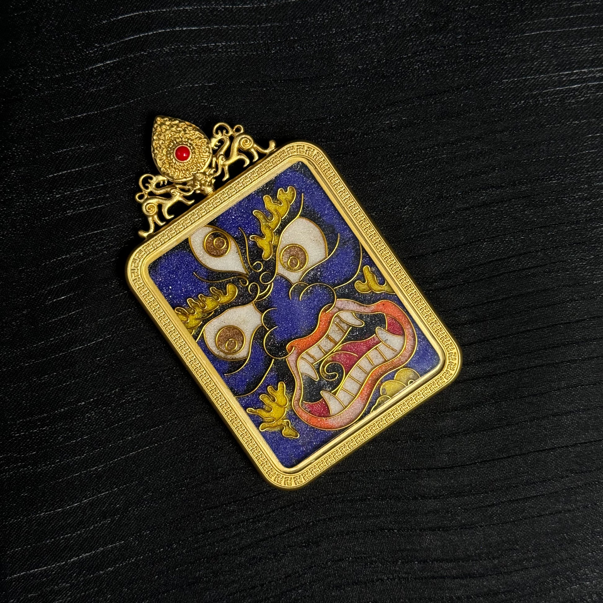 Full pendant display of handcrafted Six-Armed Mahakala cloisonné enamel mini thangka pendant with ornate gold-plated top ornament and Tibetan protector imagery