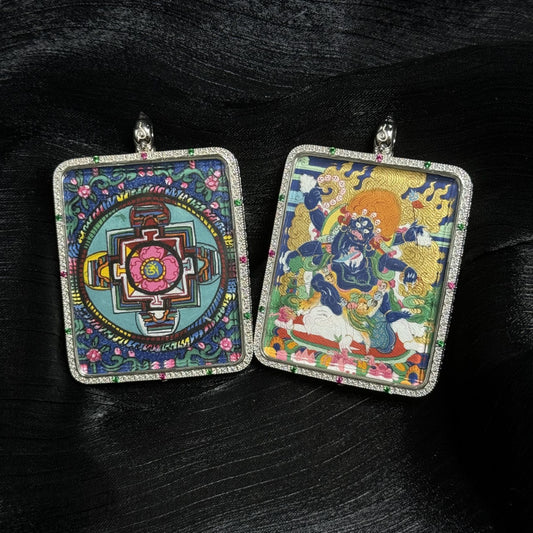 Front and back view of Six-Armed Mahakala mini thangka pendant showing hand-painted Mahakala deity on one side and traditional mandala artwork on the reverse