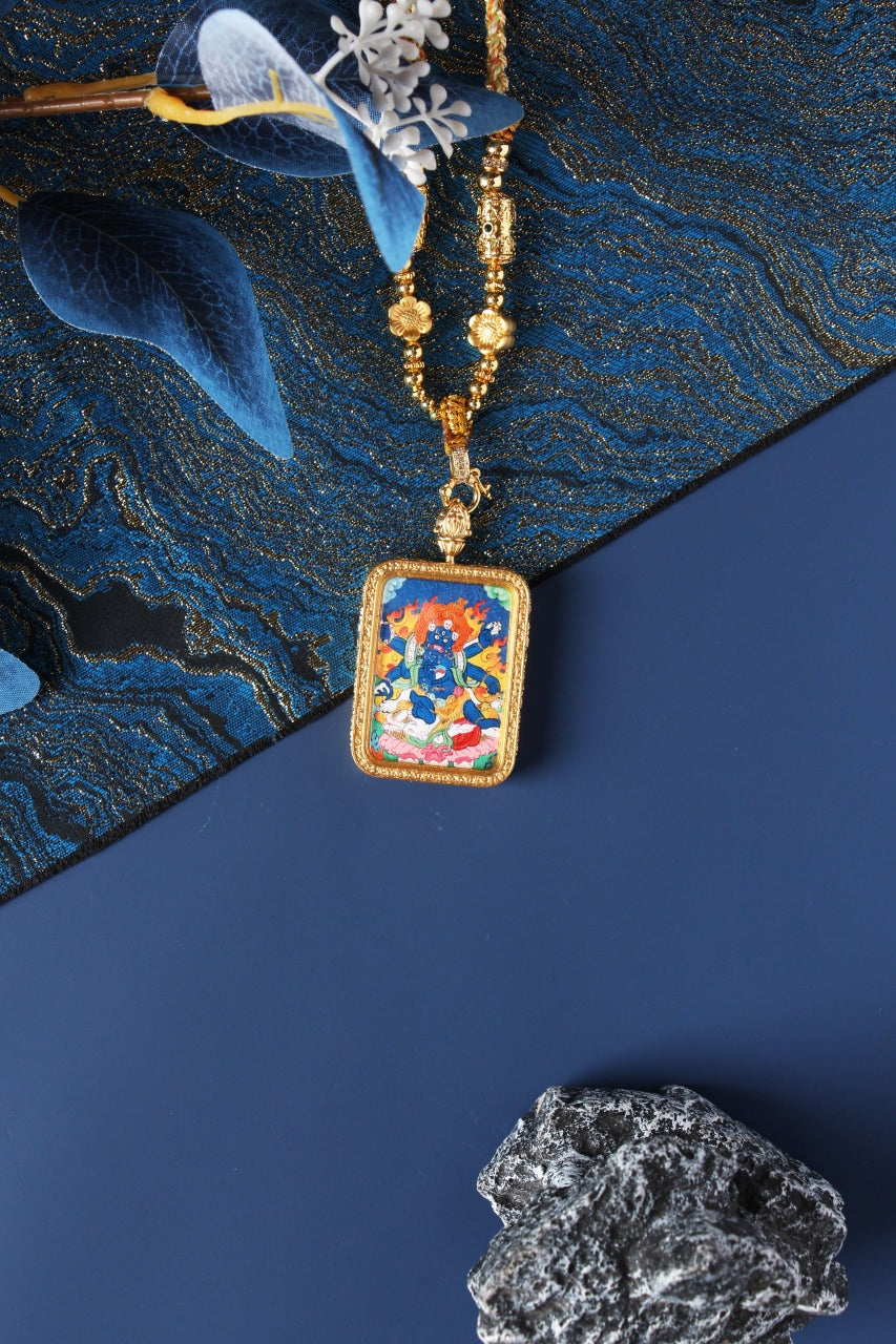 Front view of Six-Armed Mahakala mini thangka pendant, hand-painted with natural mineral pigments, set in a double-sided titanium steel case