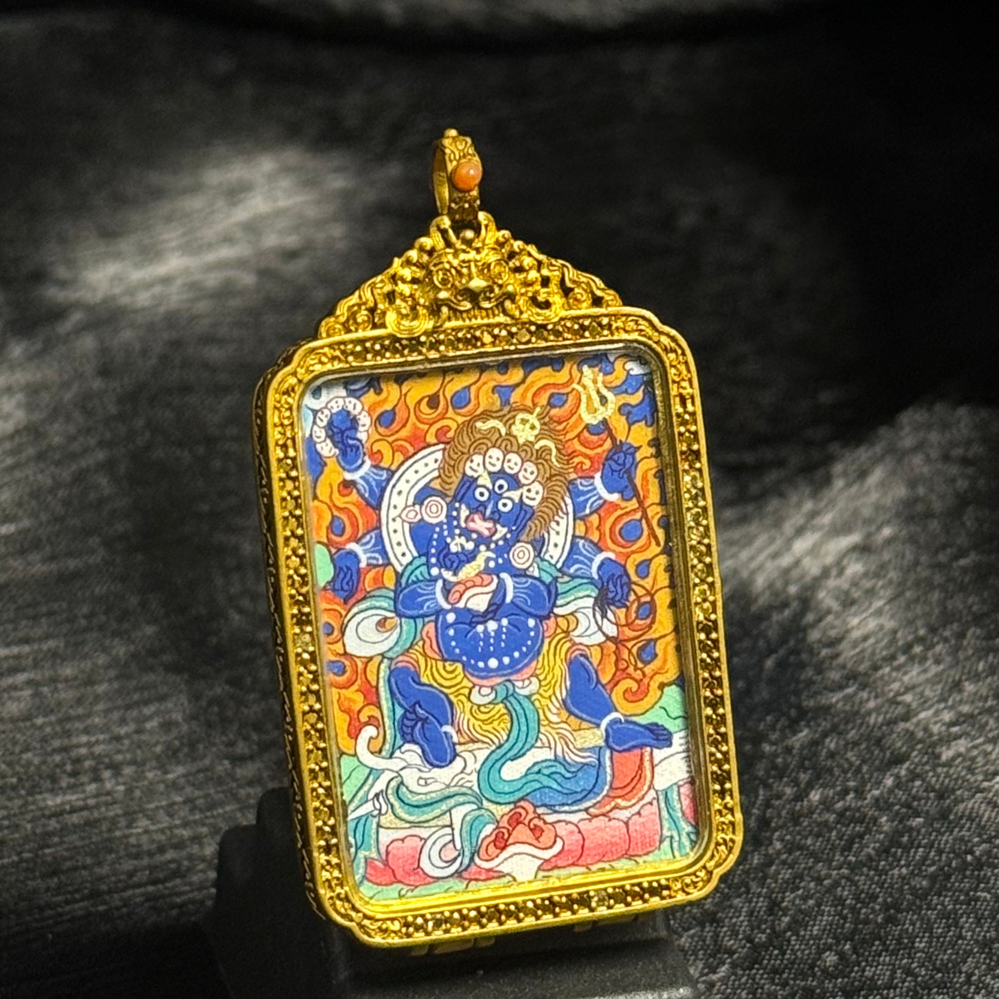 Close view of Six-Armed Mahakala miniature thangka painting created by a Rebgong artist using traditional mineral pigments