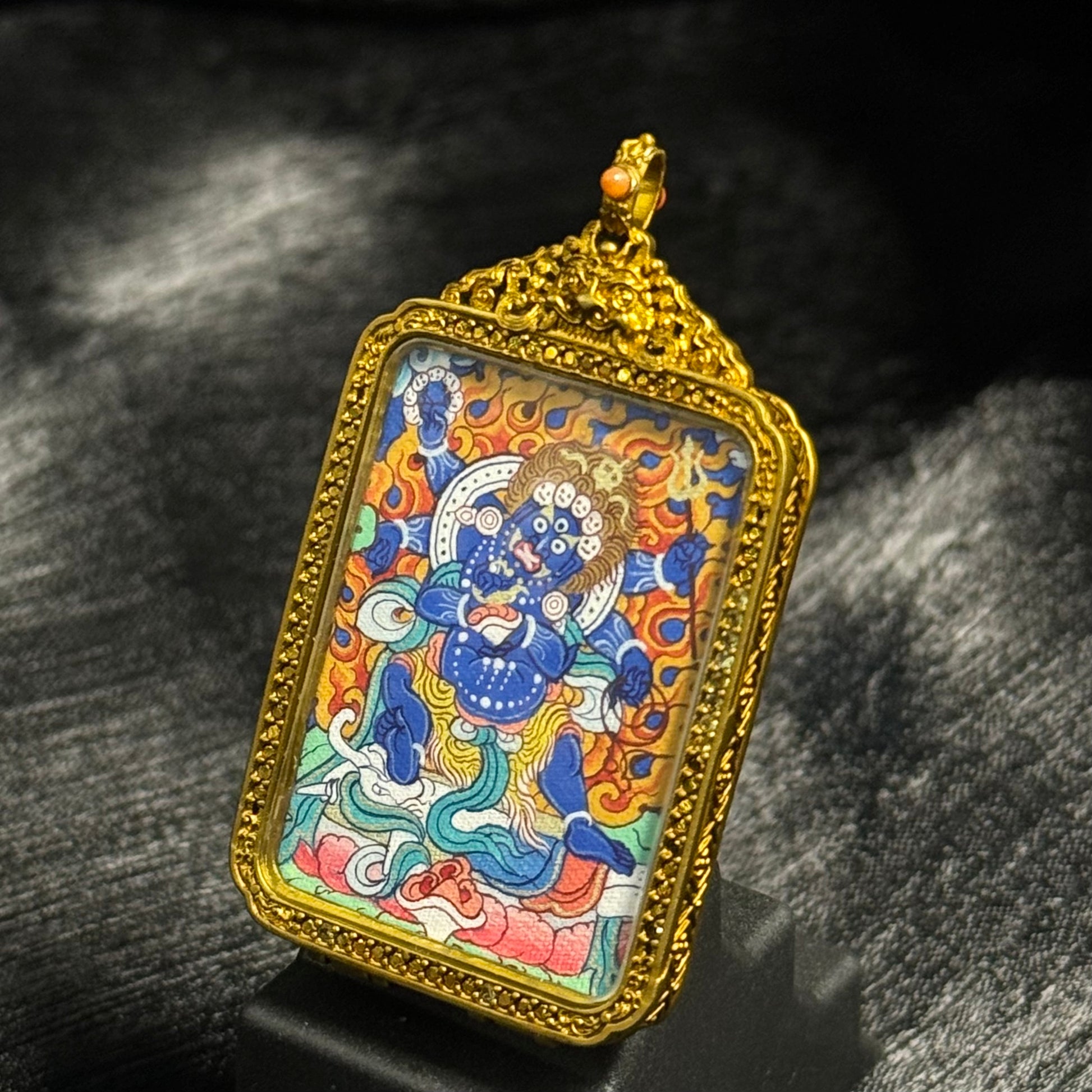 Detailed view of Six-Armed Mahakala protector deity miniature thangka pendant in traditional copper pendant case