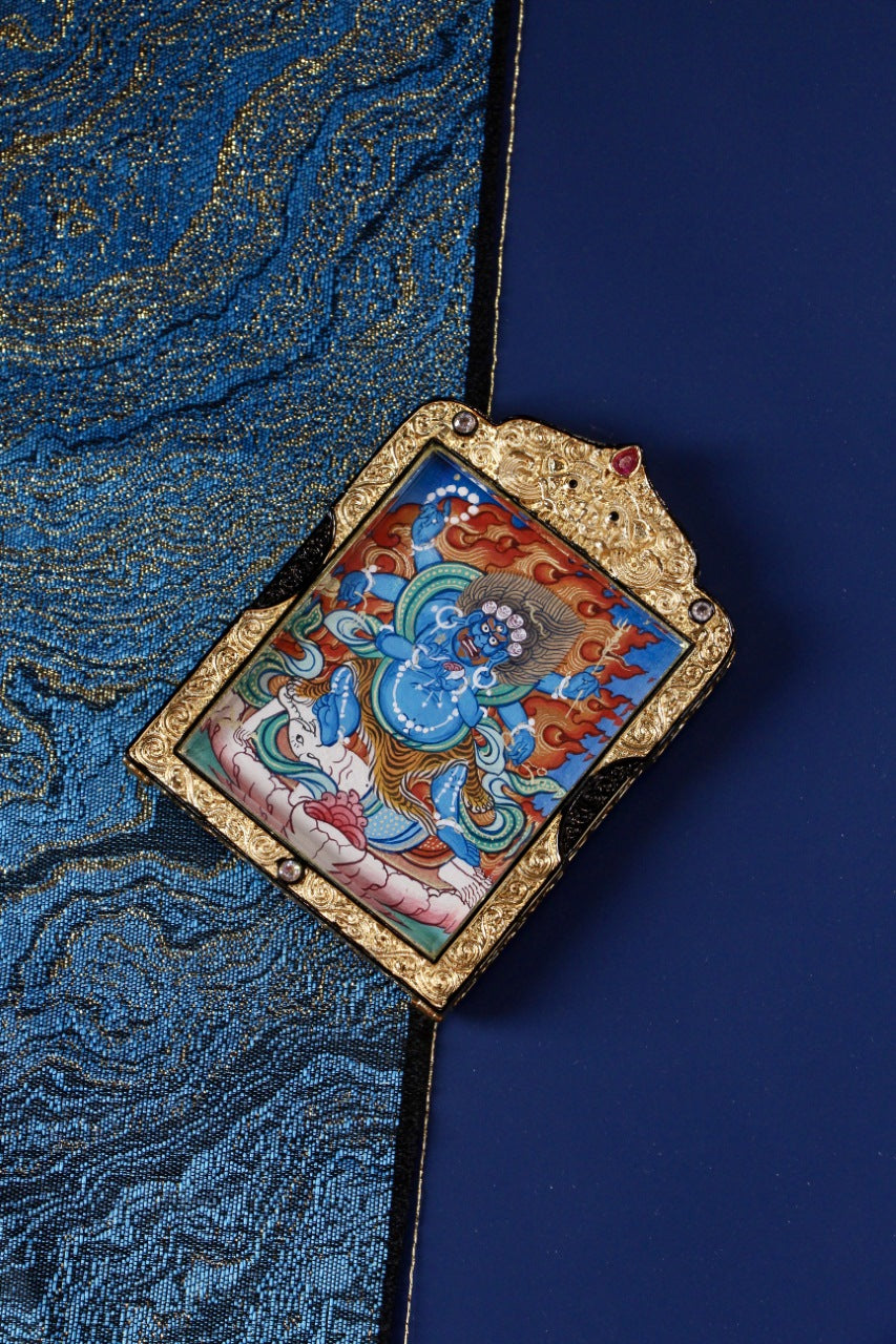 Side view of Six-Armed Mahakala Tibetan Thangka pendant highlighting black gold double-sided metal frame and fine Rebgong hand-painted details
