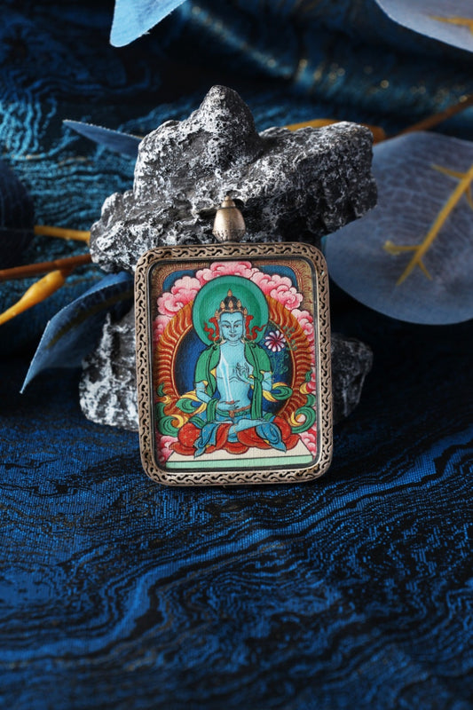 Akashagarbha Bodhisattva mini thangka pendant displayed in a Tibetan-inspired setting, hand-painted using traditional mineral pigments
