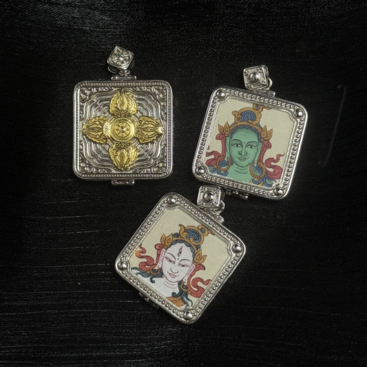 Group display of Tibetan square amulet pendants showing Green Tara and White Tara fronts and a detailed vajra (dorje) motif back in a 925 silver-plated case.