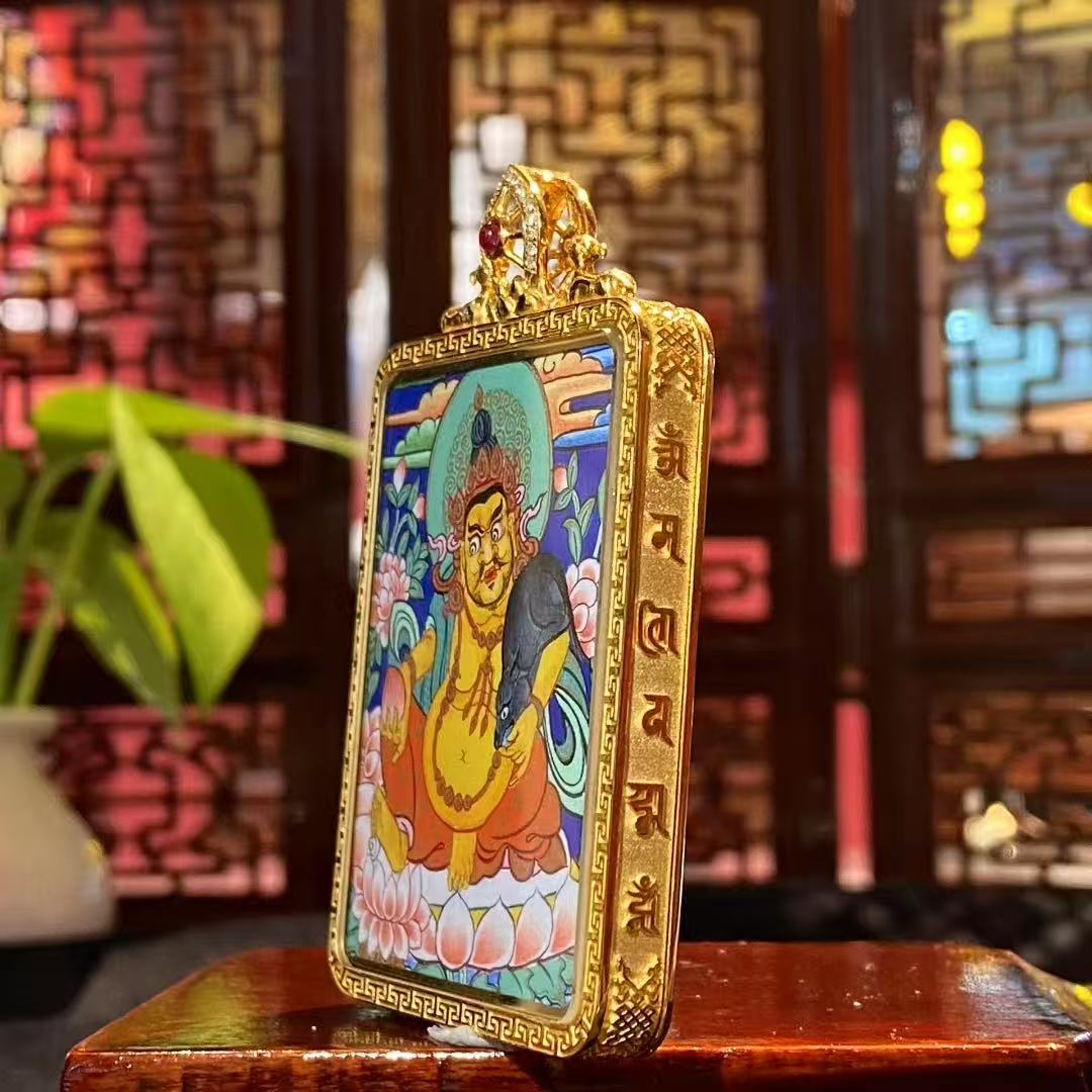Side view of an 18K gold Tibetan gau box pendant featuring a double-sided Rebgong hand-painted thangka with sapphire crystal mirror and double deer Dharma wheel finial