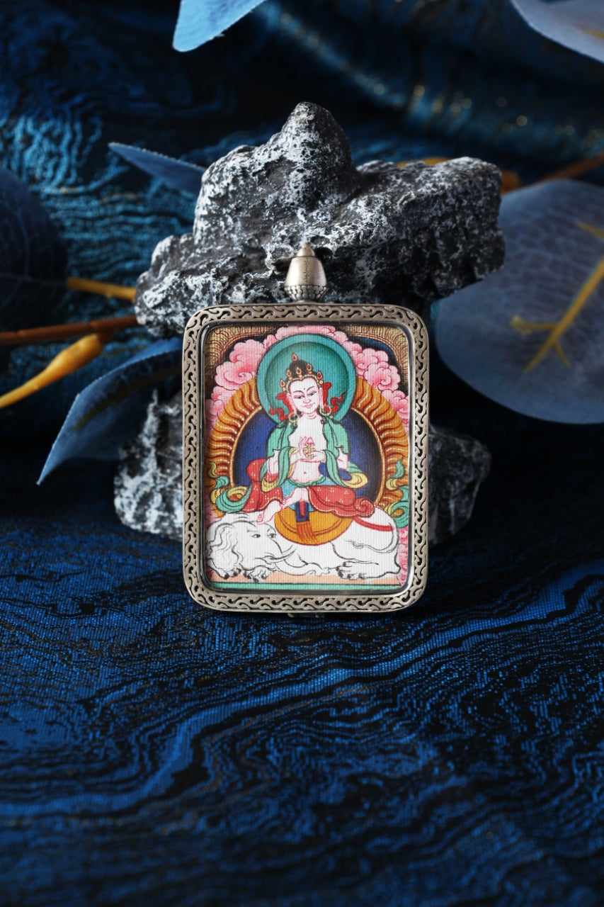 Samantabhadra Bodhisattva mini thangka pendant displayed in a Tibetan-inspired setting, hand-painted using traditional mineral pigments